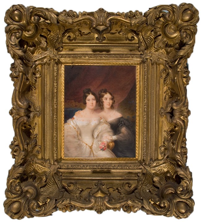 Portrait of two women, one in a white dress, one in a black dress, in a large gilt frame