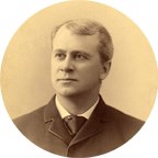historic sepia toned portrait of a man wearing a suit.