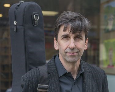 Pete Smith with guitar case