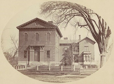 The exterior view of the Lawrence Scientific School at Harvard University, a large brick building in the 1840s