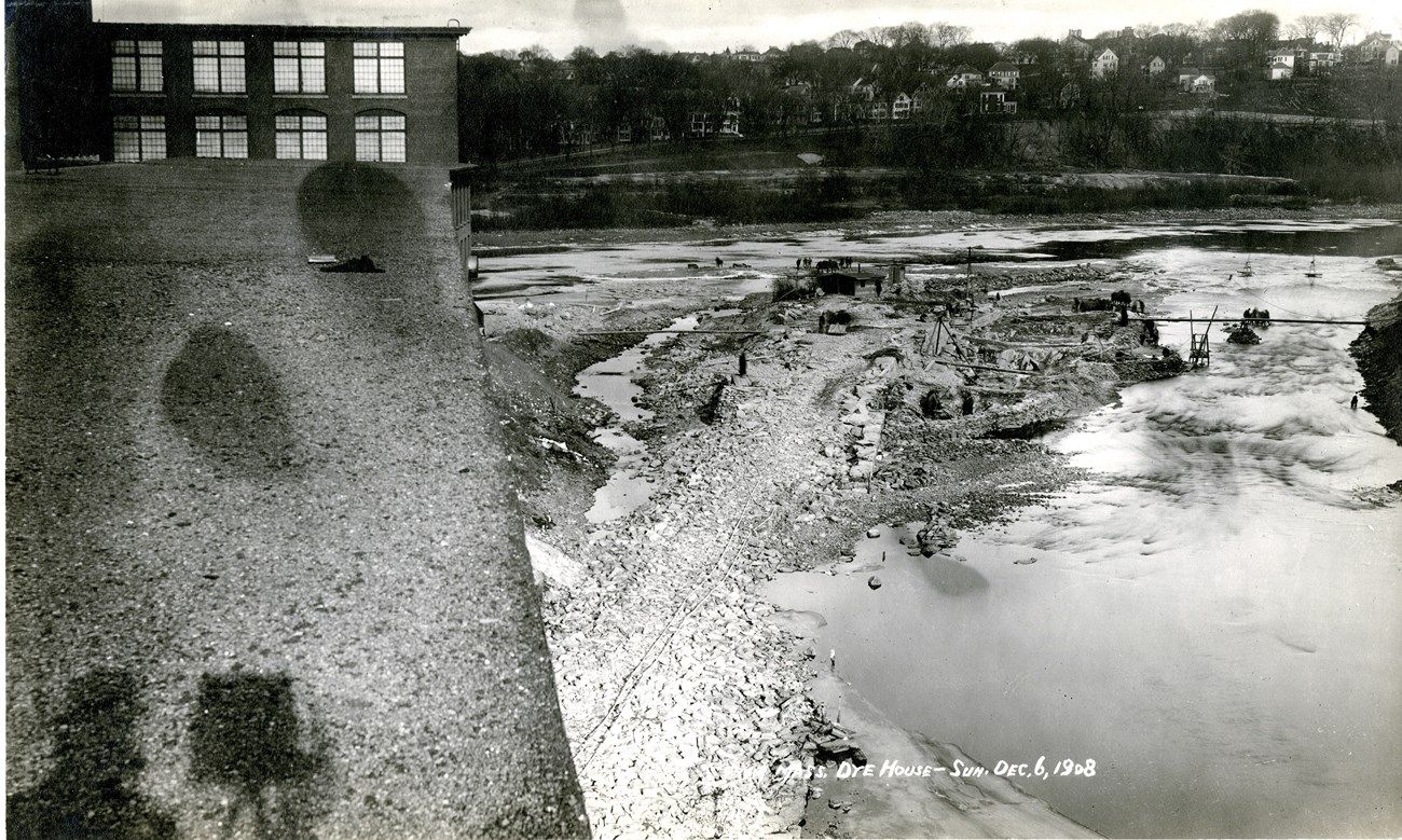 A photo showing forkers excavating ledge from the riverbed