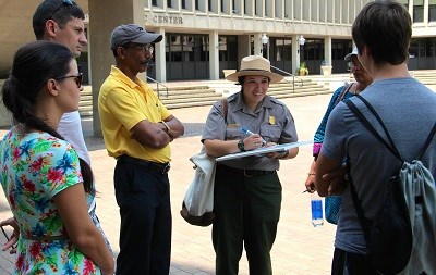 A park ranger talks with a group of visitors