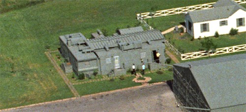 Aerial view of multiple green trailers in 1967.