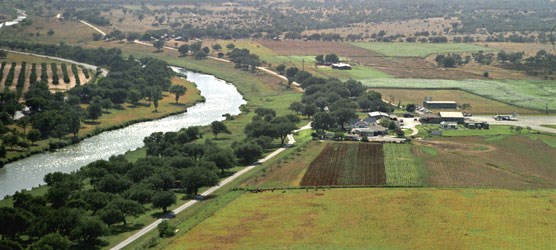 Aerial view of the Pedernales River and LBJ Ranch looking west (1967)