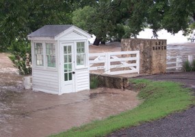 Original Ranch entrance gate engulfed in flood water (2002)