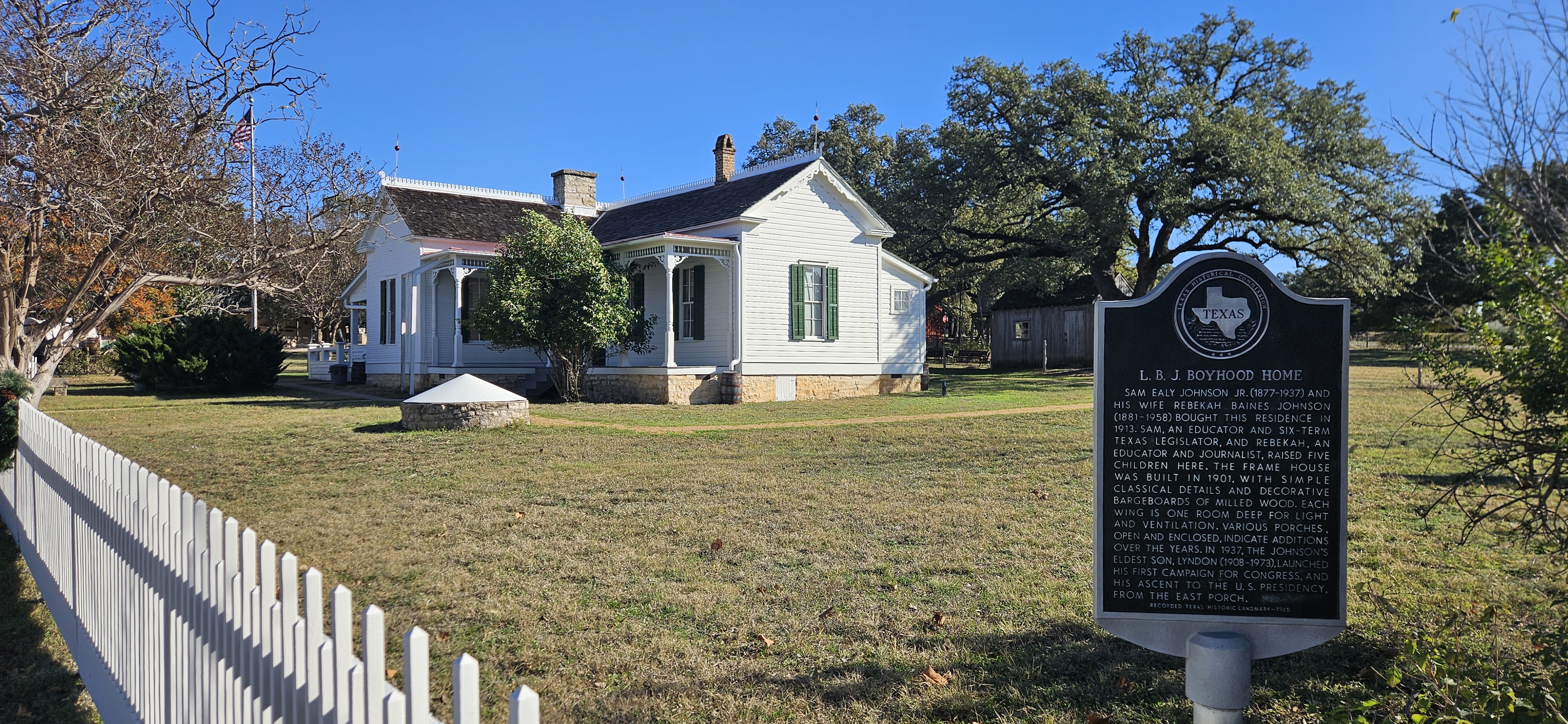 White house with white picket fence