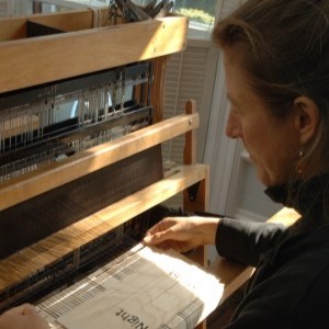 over the shoulder photo of woman weaving on loom