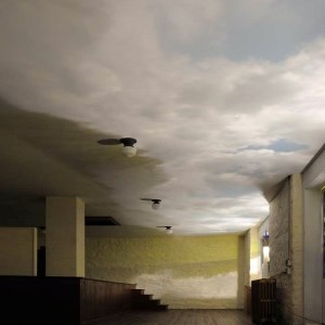 art installation, large room with yellow walls and ceiling resembling clouds in sky
