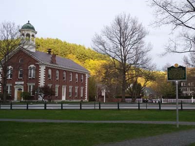 Woodstock VT town green with historic sign and courthouse