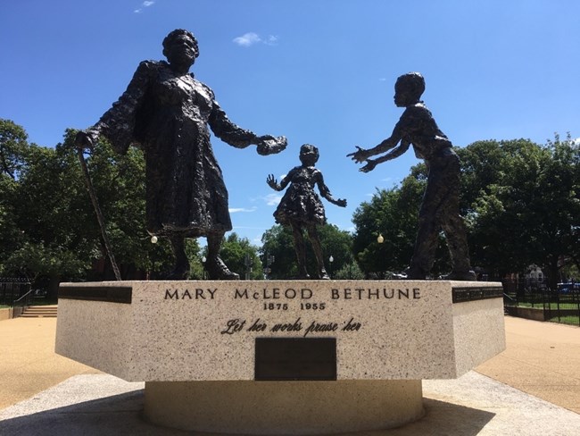 Large bronze statue outside in a public park