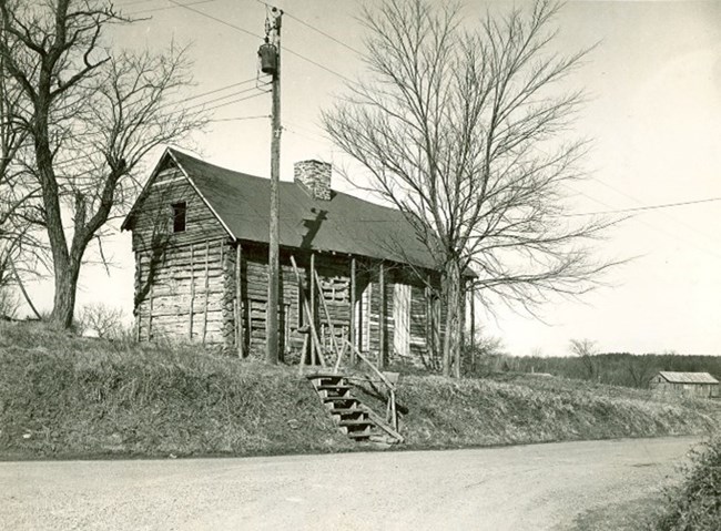 A photograph of an old wooden house.