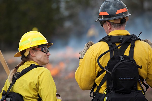 Firefighters work on a prescribed fire