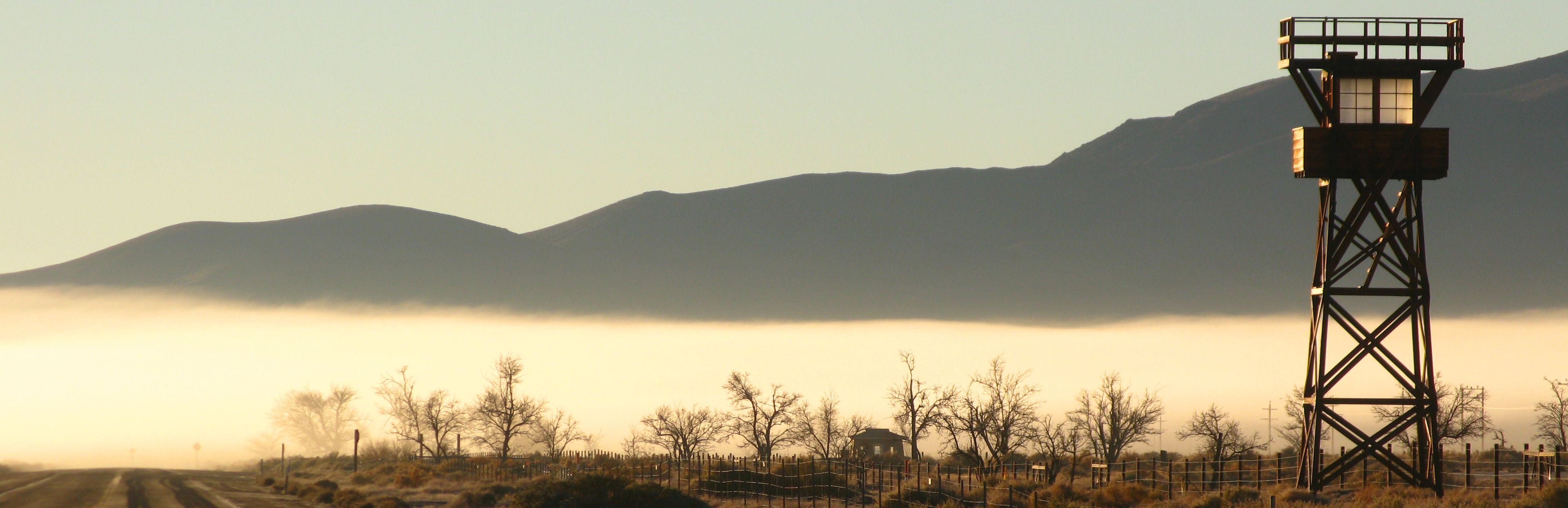 Guard tower in the hazy morning light, mountain in the background