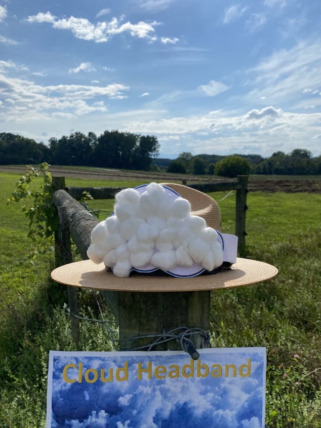 A cloud headband is placed around a Ranger hat.