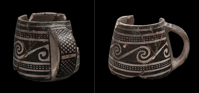 White mug with black, painted geometric designs