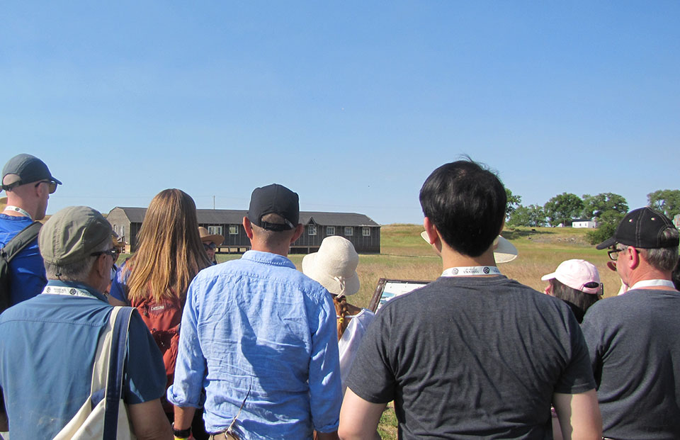 People tour Minidoka National Historic Site while attending the 2018 Minidoka Pilgrimage.