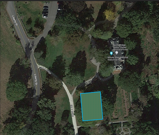 Arial photo of the North Bridge Visitor Center campus with a green shaded box marking a first amendment area