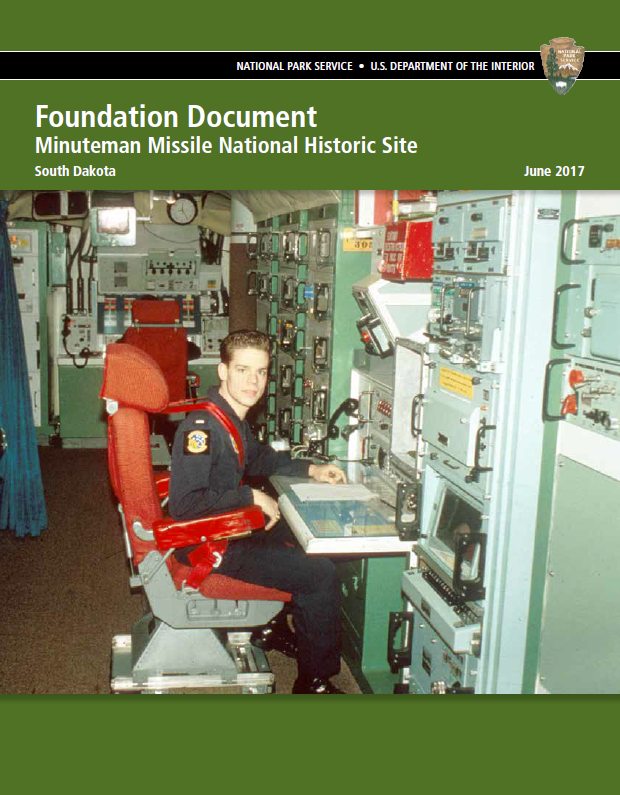 Green booklet cover with title and a historic photograph of a missile officer