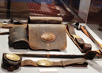 Leather US Calvary artifacts in a museum case