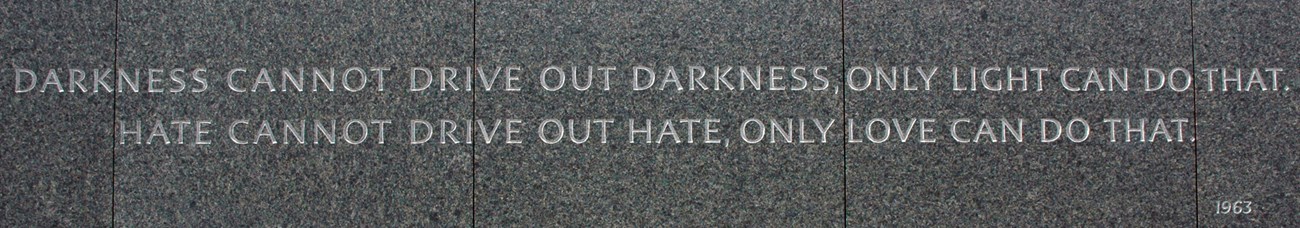 Engraved quote on black granite "Darkness cannot drive out darkness, only light can do that. Hate cannot drive out hate, only love can do that. 1963."