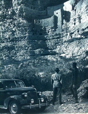 Park Ranger Earl Jackson assisting a visitor to Montezuma Castle in the 1940's.