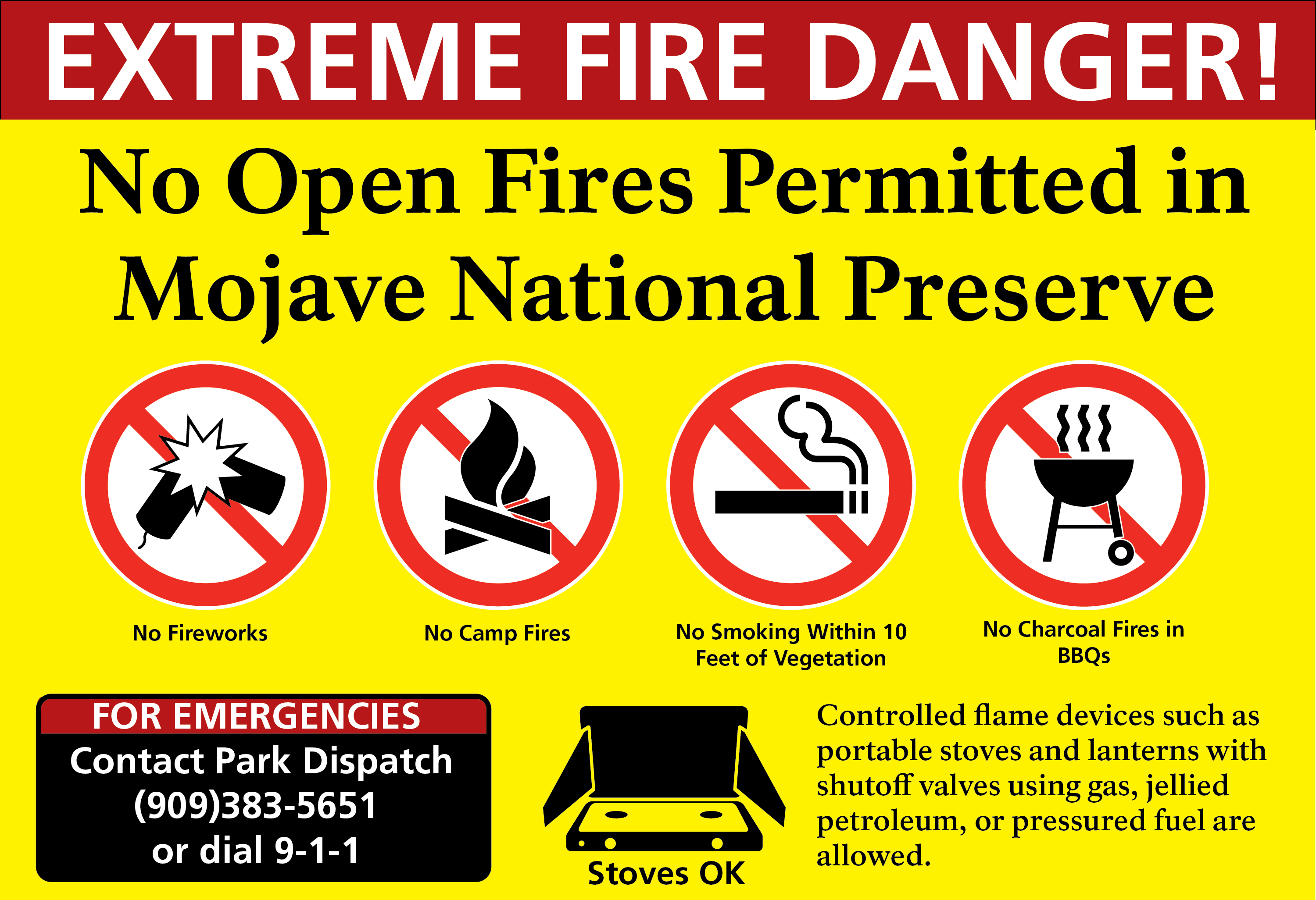 EXTREME FIRE DANGER sign reading No Open Fires permitted in Mojave National Preserve. Logos with red slash for fireworks campfires smoking and BBQs Controlled flames like Stoves Okay.