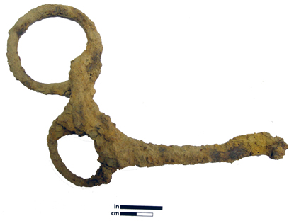 Part of a corroded bit for a horse bridle