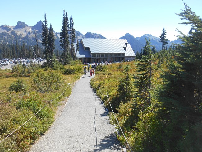 Looking down the trail at the second Jackson Visitor Center and Tatoosh Mountains.