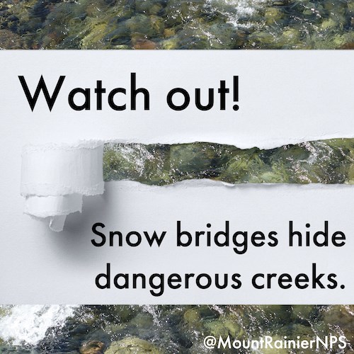A photo of a rocky river covered in the middle by a white piece of paper. A torn-away, curling strip of paper reveals the water underneath. Text on the paper reads "Watch Out! Snow bridges hide dangerous creeks."