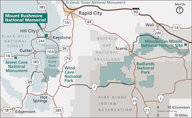 A map of national park sites near the Black Hills.  Interstate 90 cuts across the upper right corner.  Badlands and Minuteman Missile are shown on the right side of the map.  Mount Rushmore, Jewel Cave and Wind Cave are on the left.