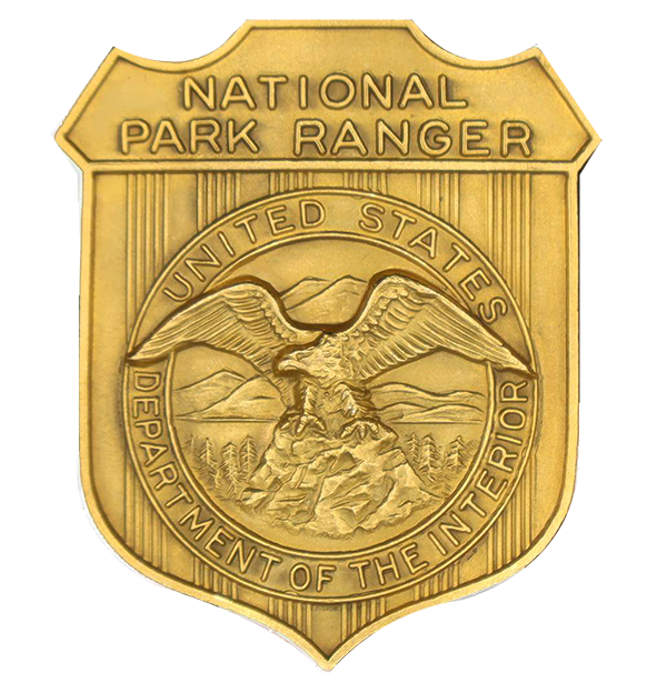 Gold shield-shaped badge marked National Park Ranger. The round seal in the middle has an eagle looking to its right.
