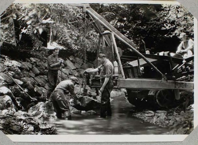 Civilian Conservation Corps (CCC) crews at work building stone revetments in Redwood Creek, June 1936.