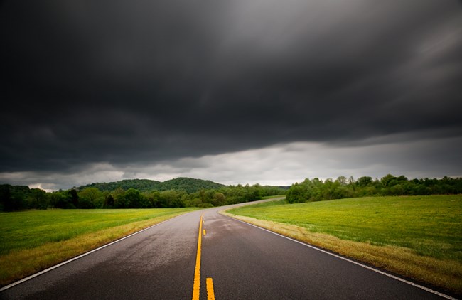 Dark clouds above  the Natchez Trace Parkway road way