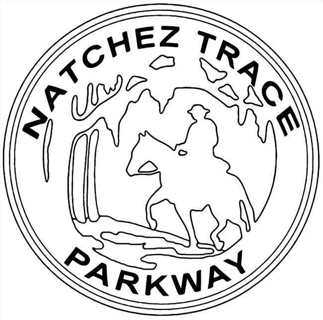 black line drawing representing the Natchez Trace Post Rider Symbol. The words Natchez Trace Parkway go around the circle with a silhouette of a man riding a horse in the middle.