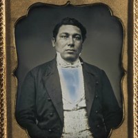 Framed, sepia photo of Captain Amos Haskins.