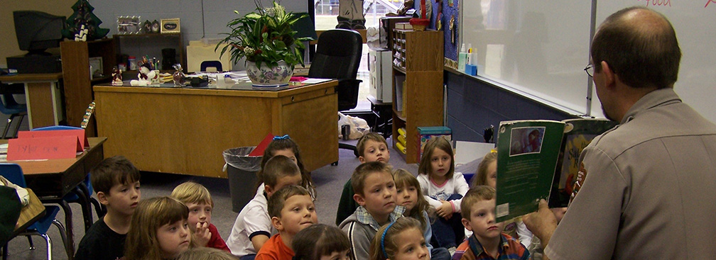 ranger in a classroom with young students