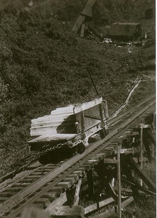 historic photo of a haulage car being pulled by a chain on a track