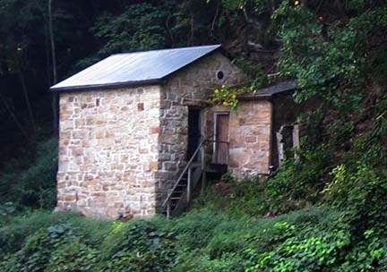 old stone building in a forest