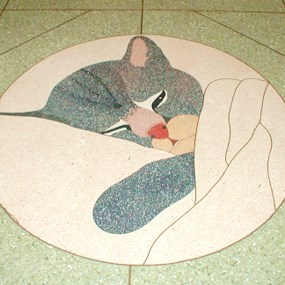 floor tile design of sleeping kitten's head and paw poking out of a blanket