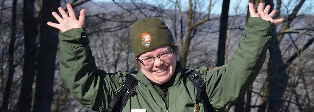 Park Ranger with hands in the air