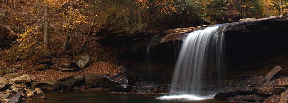 waterfall cascading over rock ledge