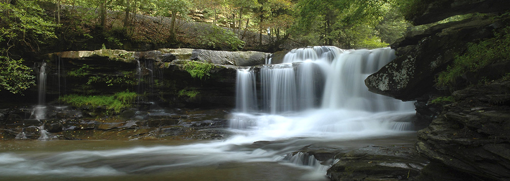 waterfall cascading over a rock ledge