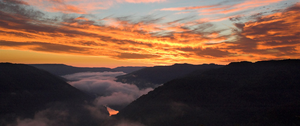 sunset over a deep river gorge