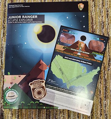 Junior Ranger book, badge, and eclipse viewer