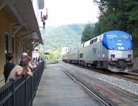 Visitors watching as AMTRAK train goes by at the Thurmond Depot