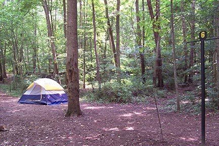 A tent set up at a campsite.