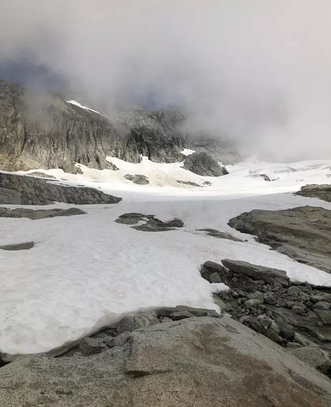 Rocky terrain partially covered with snow