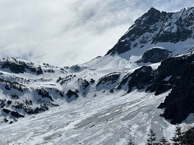 Mountain pass covered in lspring snow