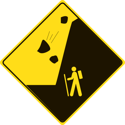 A yellow diamond sign with falling rocks above a hiker