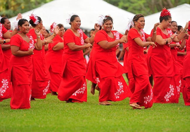 Young Samoan women performing traditional dance.